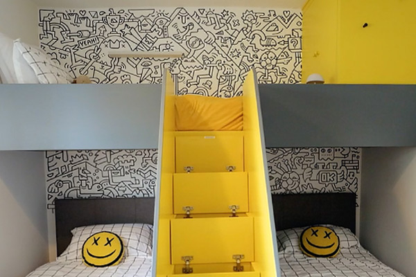Sort Your Life Out BBC Doodle Wall Mister Phil Illustration. Photo of boys bedroom with wall mural and yellow furniture